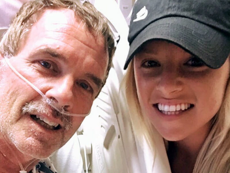 Heart attack and cardiac arrest survivor Mark Kleinschmidt (left) and his daughter Allison, who happened to be visiting when Mark collapsed. She administered CPR for 20 minutes until first responders arrived. (Photo courtesy of Mark Kleinschmidt)