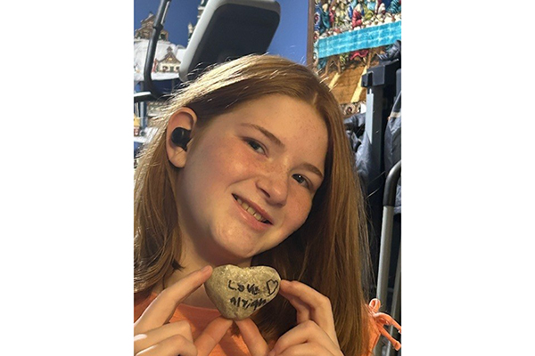 Alyiah Luntzer, 11, of Richmond, Virginia, shows the heart-shaped rock she gave to her grandmother