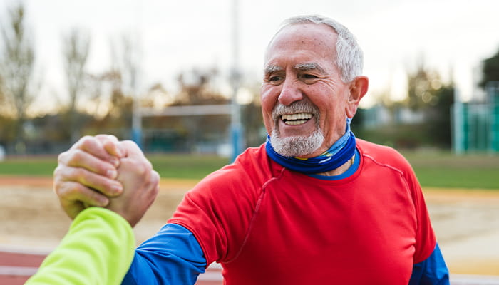 Man giving handshake and smiling