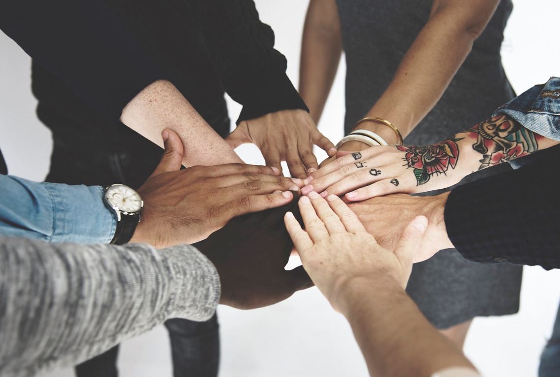Diverse group of hands in a circle
