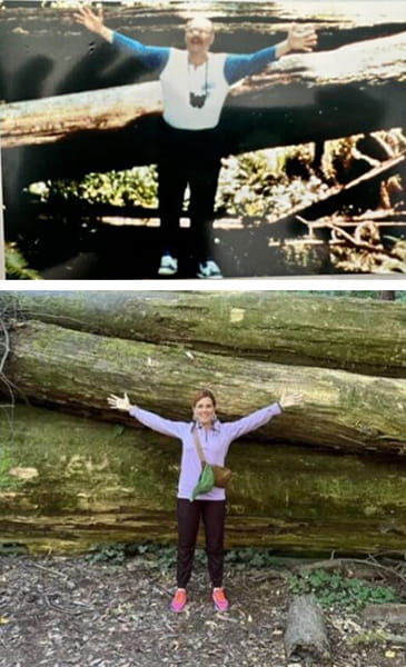 David Ahlvers posing with arms spread wide in front of large fallen tree; his adult daughter, Leslie Amick, imitating his pose in a similar location